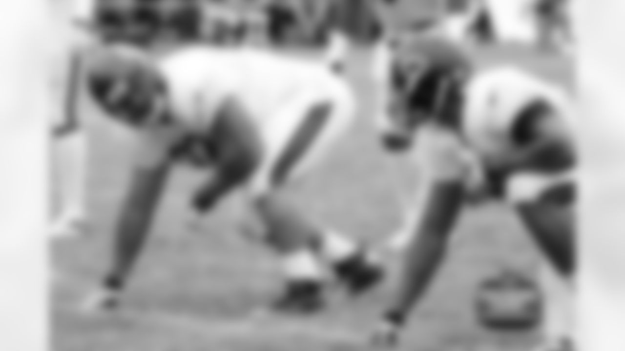 DT Stephen Paea checks with DE Corey Wootton before the ball is snapped.