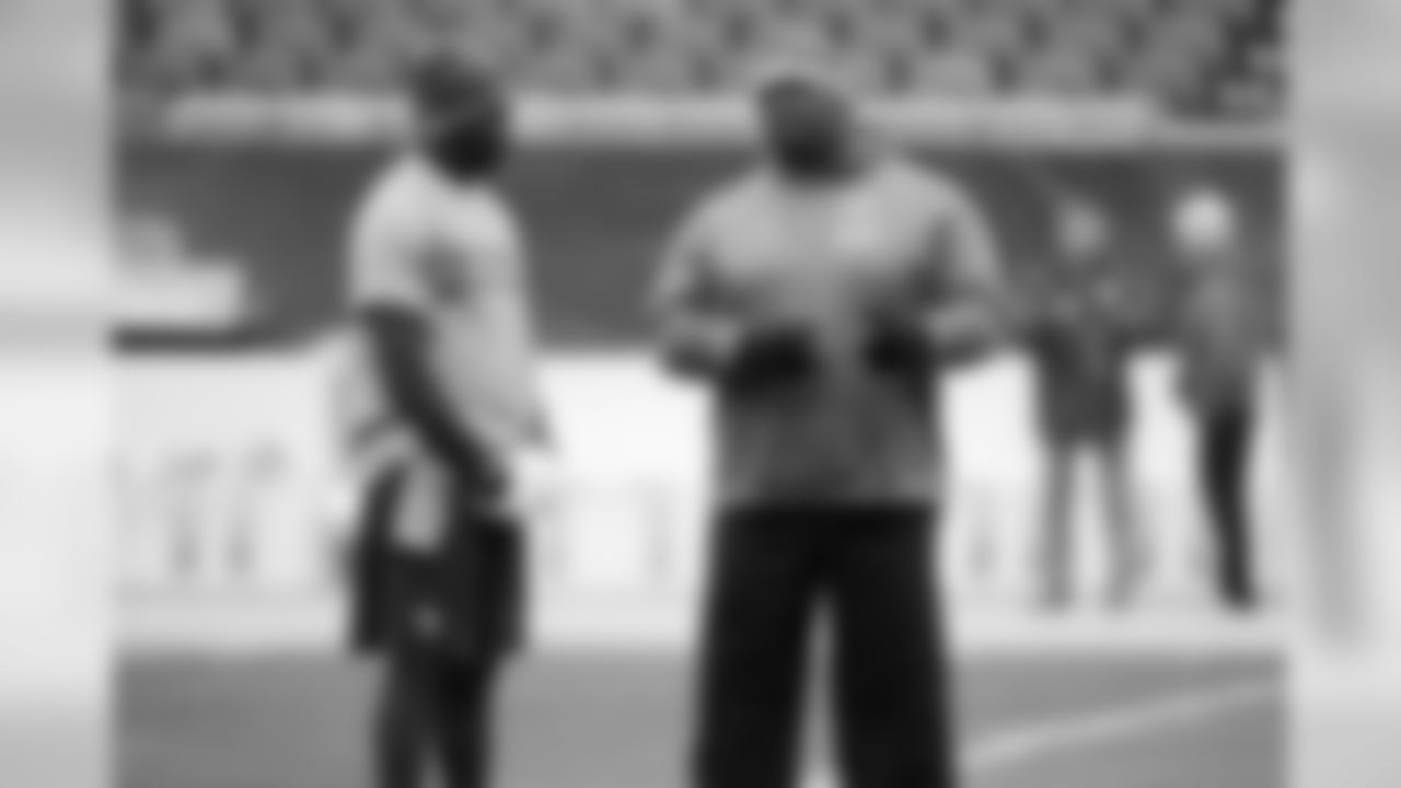 Minnesota Vikings quarterback Teddy Bridgewater talks to Chicago Bears assistant defensive line coach Clint Hurtt.