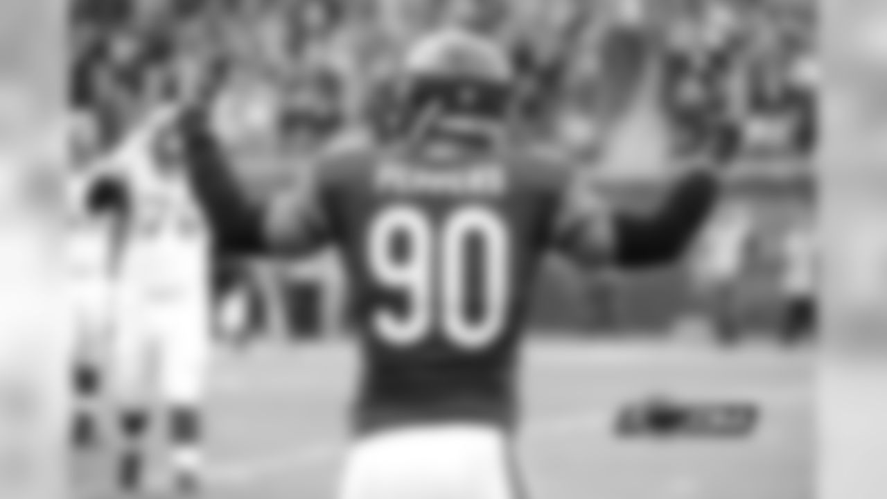 Julius Peppers reacts after pressuring Christian Ponder into throwing an incomplete pass on fourth-and-two, forcing the Vikings to turn the ball over on downs.