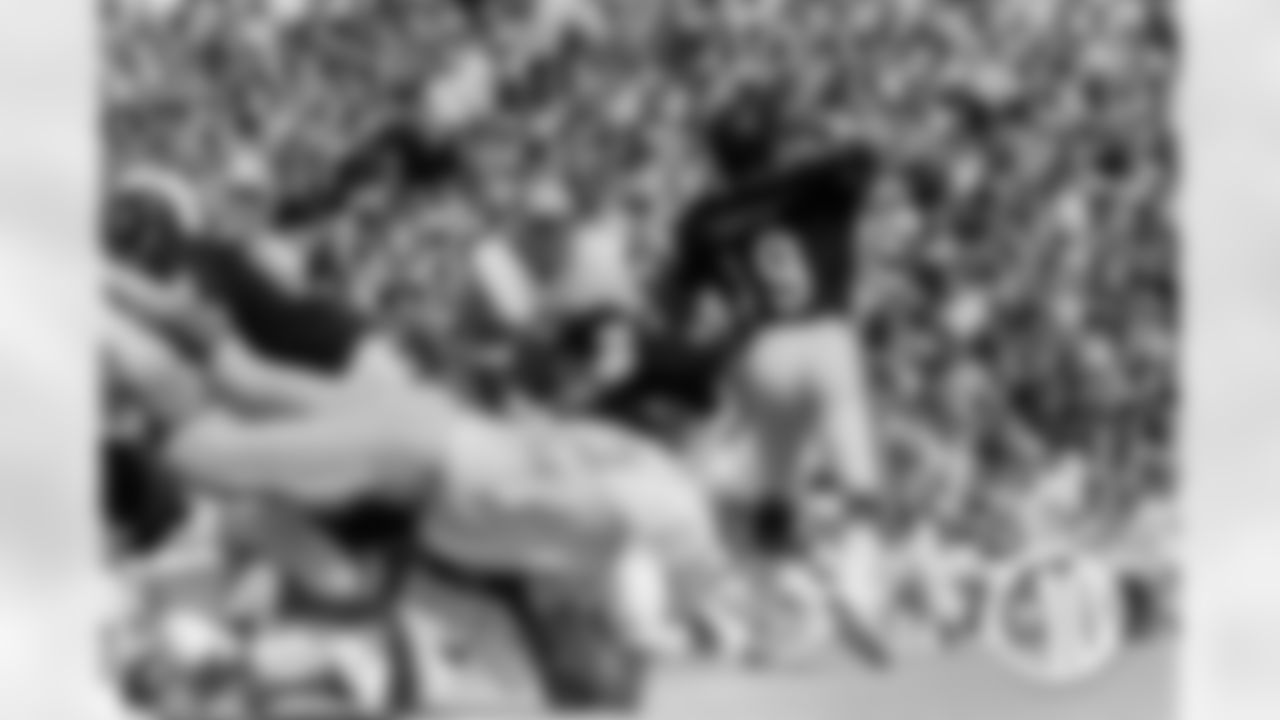 Wade had two catches for 116 yards versus Detroit. Pictured: Bears quarterback Gary Huff (19) throws a pass against the Lions at Soldier Field on September 15, 1974.