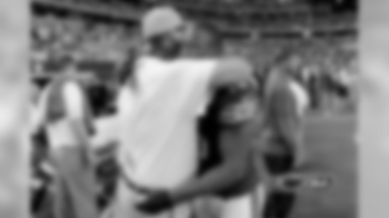 Bears WR Brandon Marshall and OC Mike Tice embrace after routing the Dallas Cowboys 34-18 Monday night.