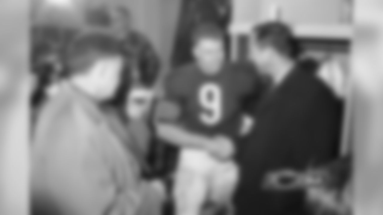 National Football League Commissioner Pete Rozelle, right, has a handshake for Chicago Bears quarterback Bill Wade after the Bears beat the New York Giants for the NFL title.
