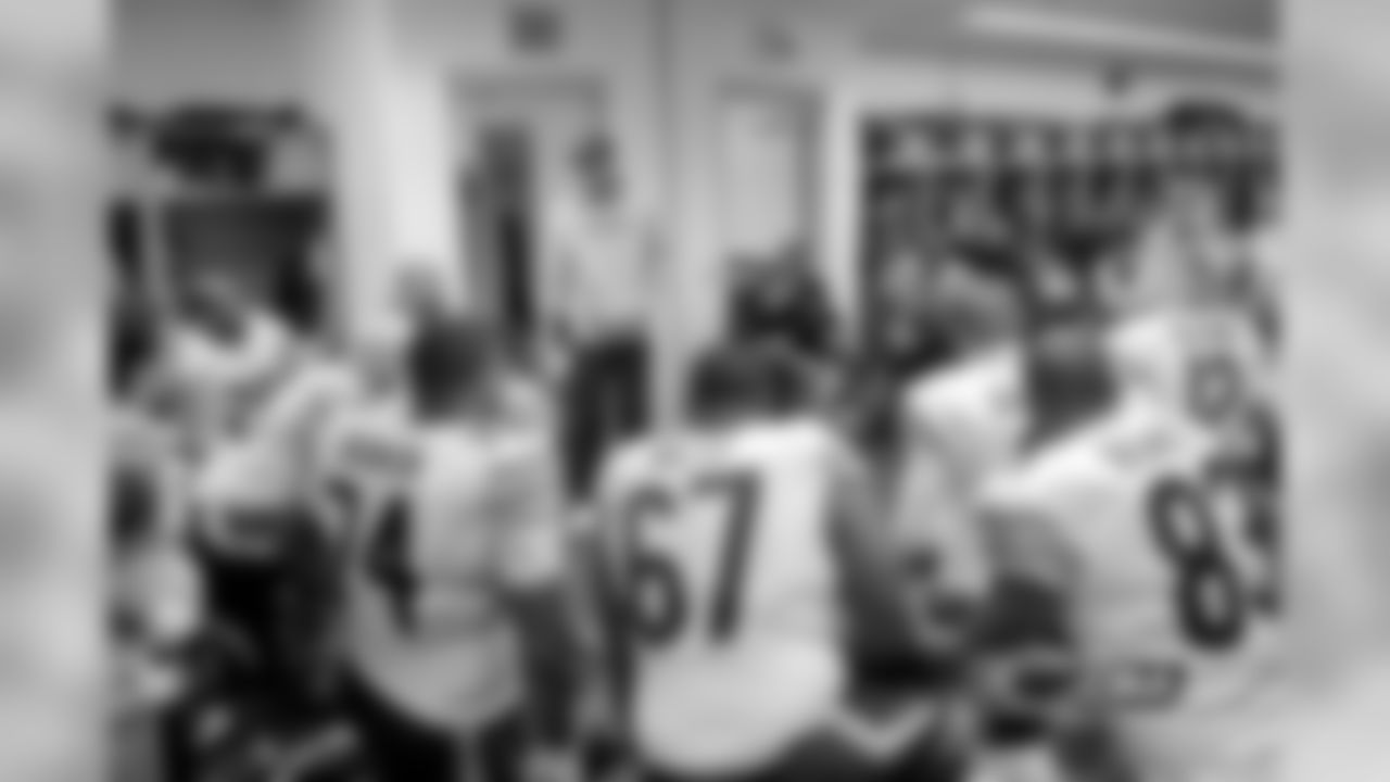 Head coach Marc Trestman address his team before the game.