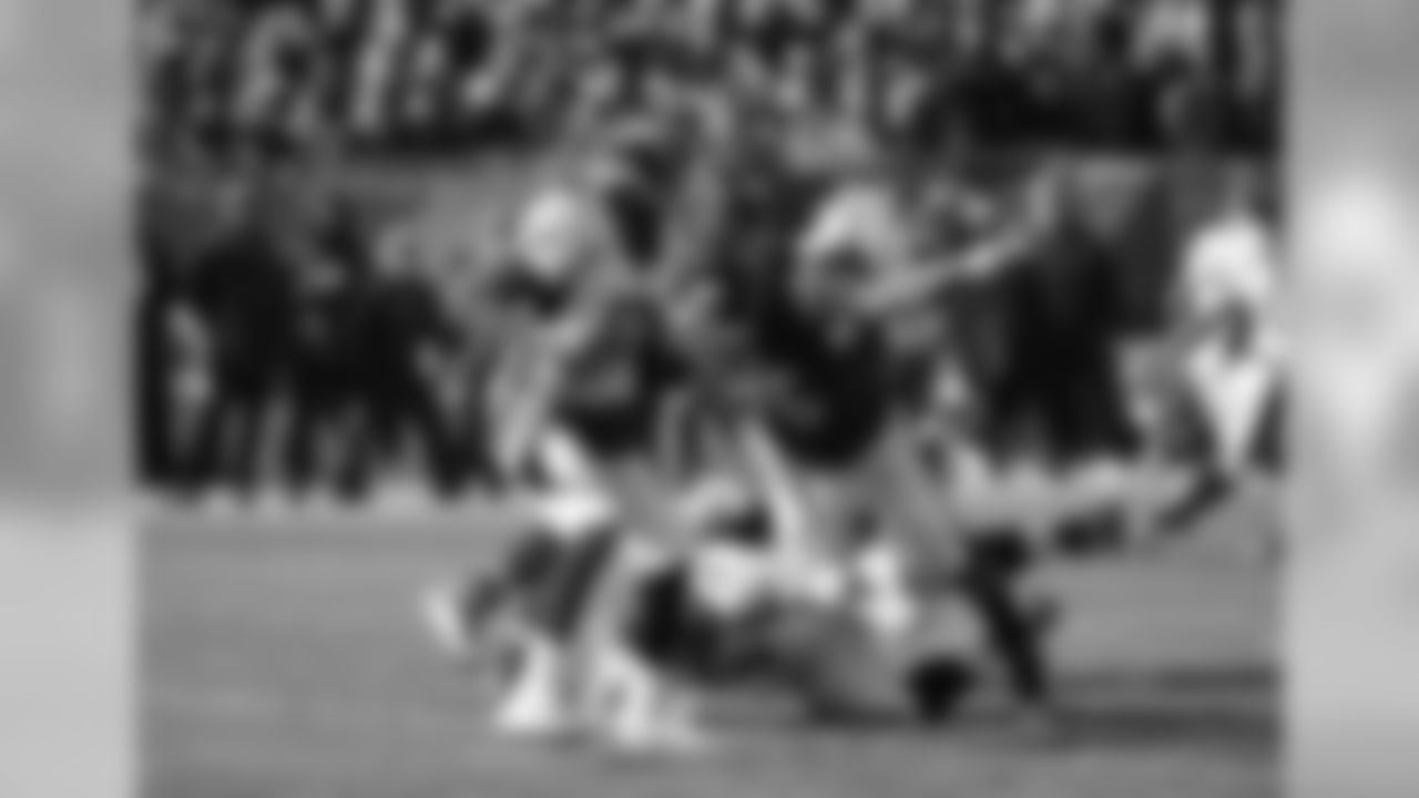 Denver Broncos quarterback Brock Osweiler is sacked by Chicago Bears nose tackle Bruce Gaston