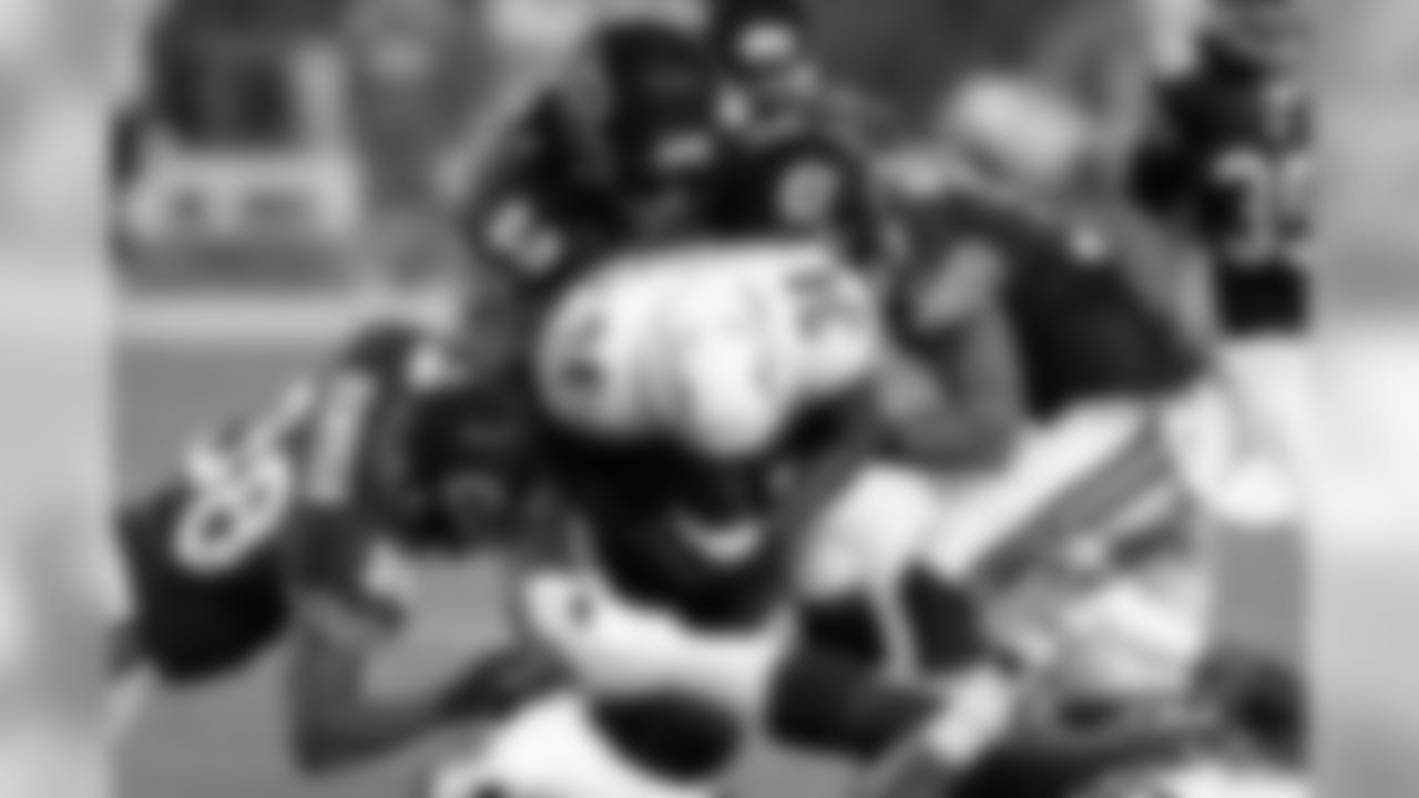 38 Zack Bowman, #60 Khaseem Greene and #37Anthony Walters team up to smother Chargers running back Fozzy Whittaker in the backfield.
