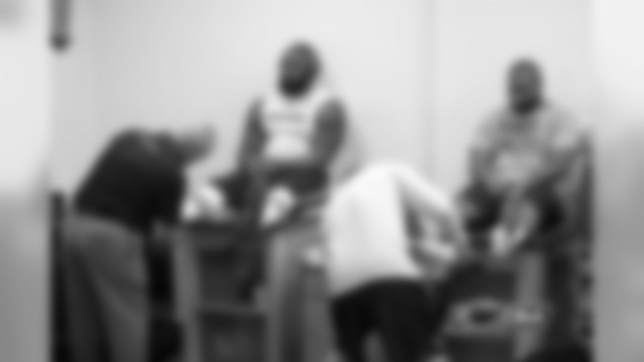 Defensive tackle Jay Ratliff and lineback Lance Briggs get their ankles taped.