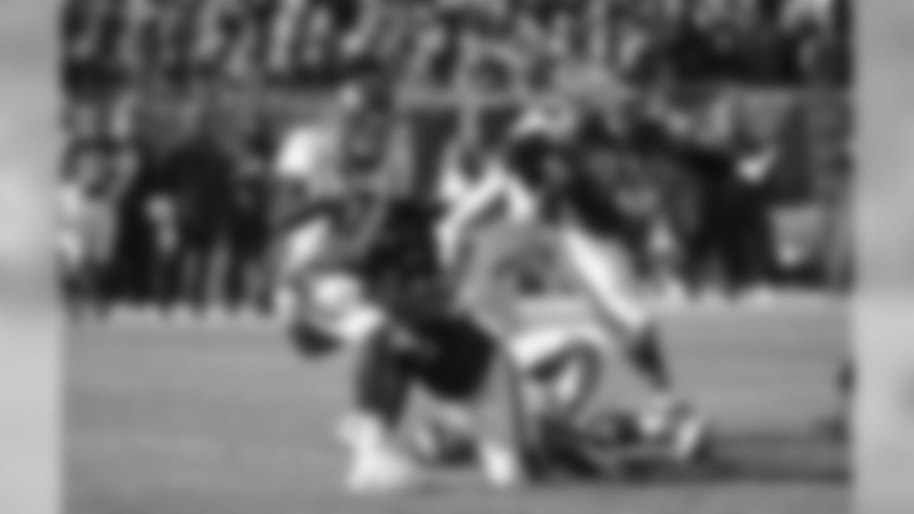 Denver Broncos quarterback Brock Osweiler is sacked by Chicago Bears nose tackle Bruce Gaston