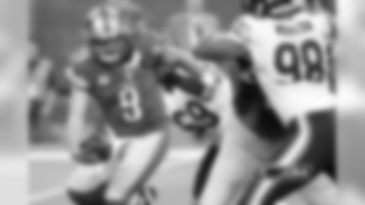 69 Henry Melton narrowly sacks Lions QB Matthew Stafford on the opening drive of the game.