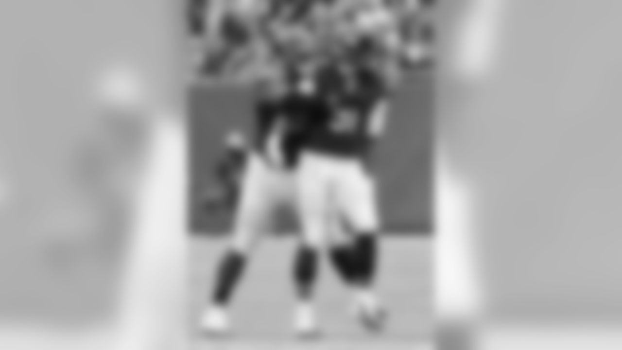 Bears DE David Bass celebrates a sack with DT Ego Ferguson