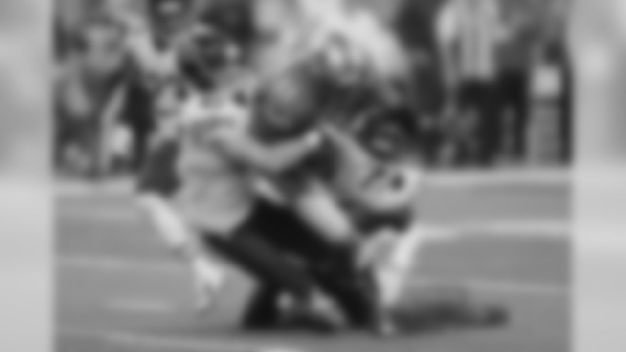 Detroit Lions wide receiver Calvin Johnson is stopped by Chicago Bears free safety Chris Conte.