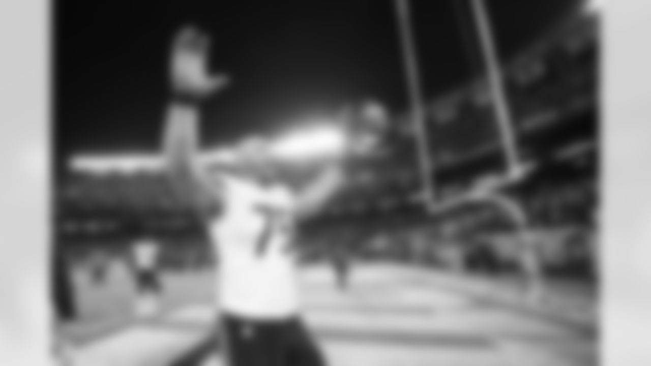 Chicago Bears offensive tackle Kyle Long celebrates with fans after the game