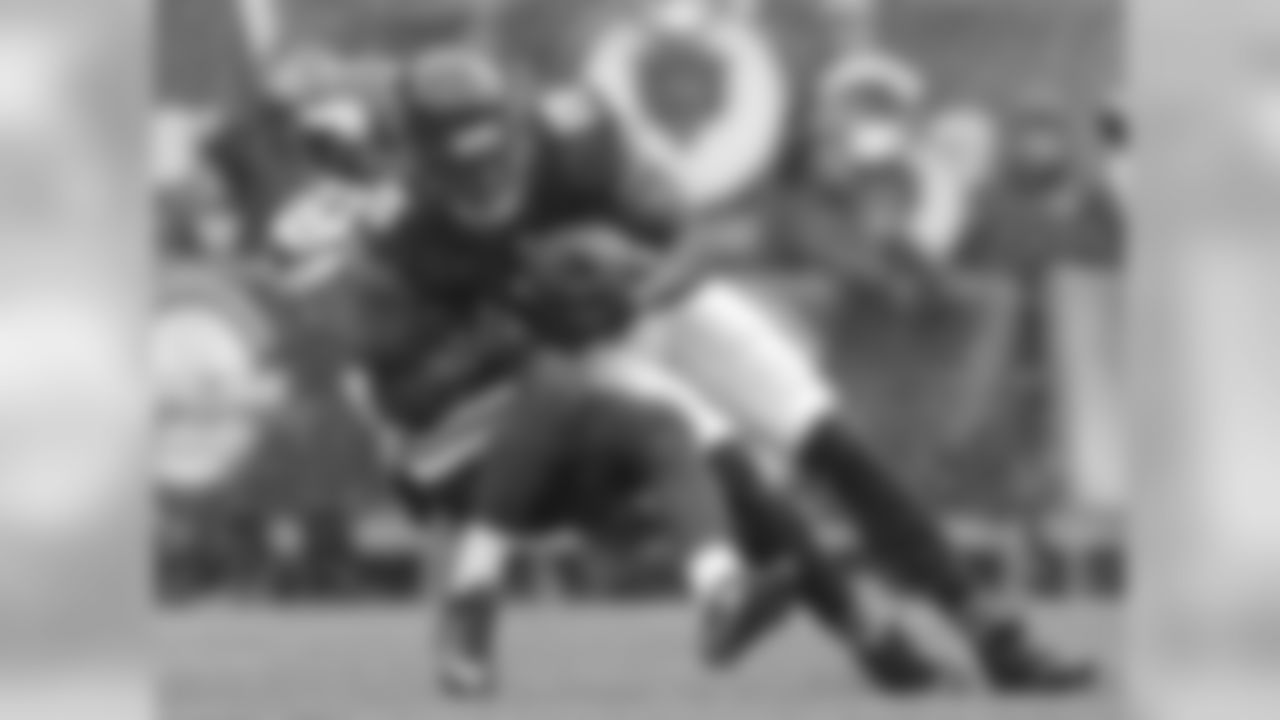 Chicago Bears WR Brandon Marshall is tackled by Vikings CB Captain Munnerlyn.