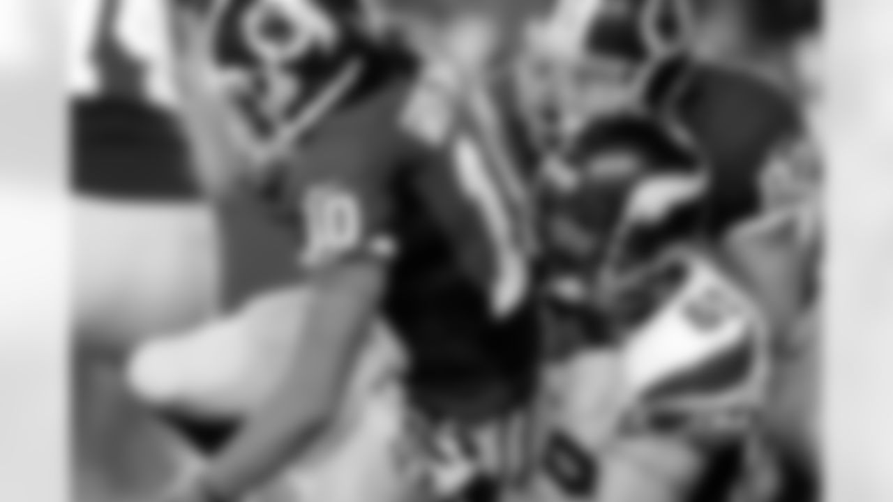 Washington Redskins quarterback Robert Griffin III (10) is sacked by Minnesota Vikings defensive end Jared Allen.