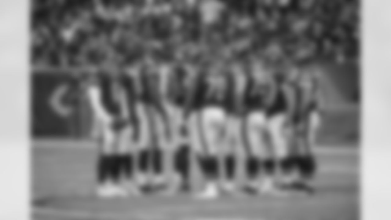 Chicago Bears huddle before a play.
