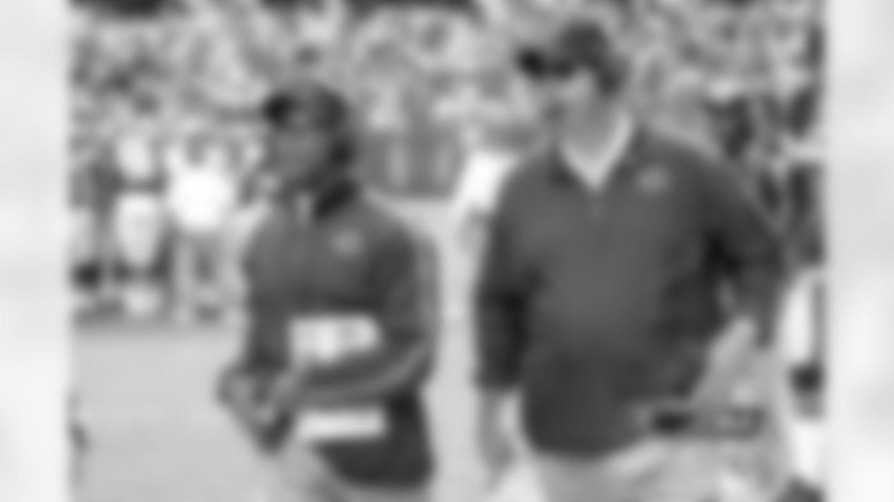 Bears HC Lovie Smith and OC Mike Tice look on as the NFL refs review the proceeding play.
