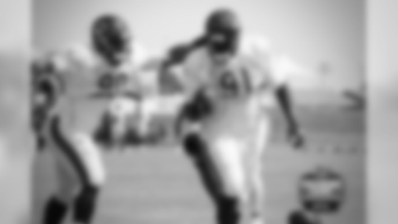 DL Cornelius Washington (90) and DL Eddie Goldman (91).
