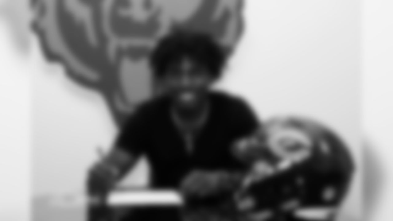 Seventh-round draft pick Javon Wims signs his contract.