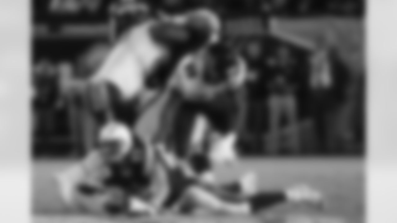 San Diego Chargers quarterback Philip Rivers is sacked by Chicago Bears linebacker Lamarr Houston