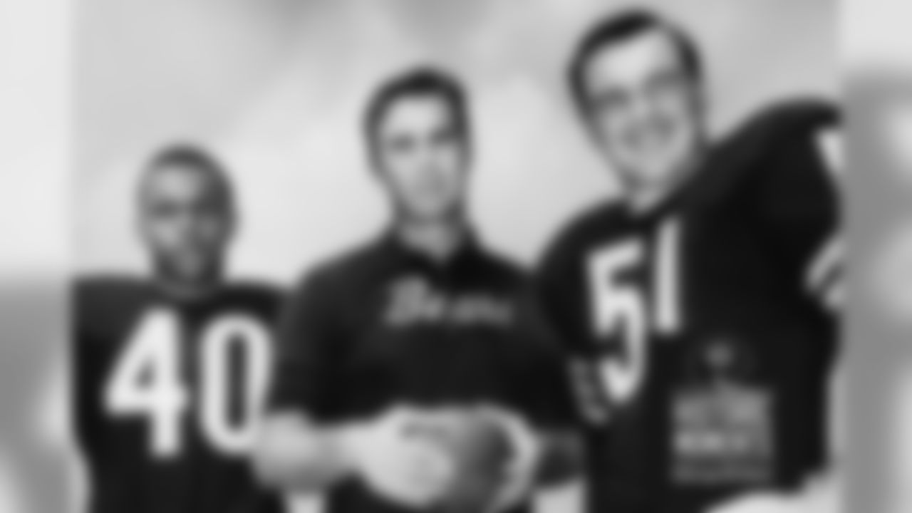 Bears coach Jim Dooley stands between Gale Sayers and Dick Butkus in 1968. Bears Historic Moments - Chicago Tribune