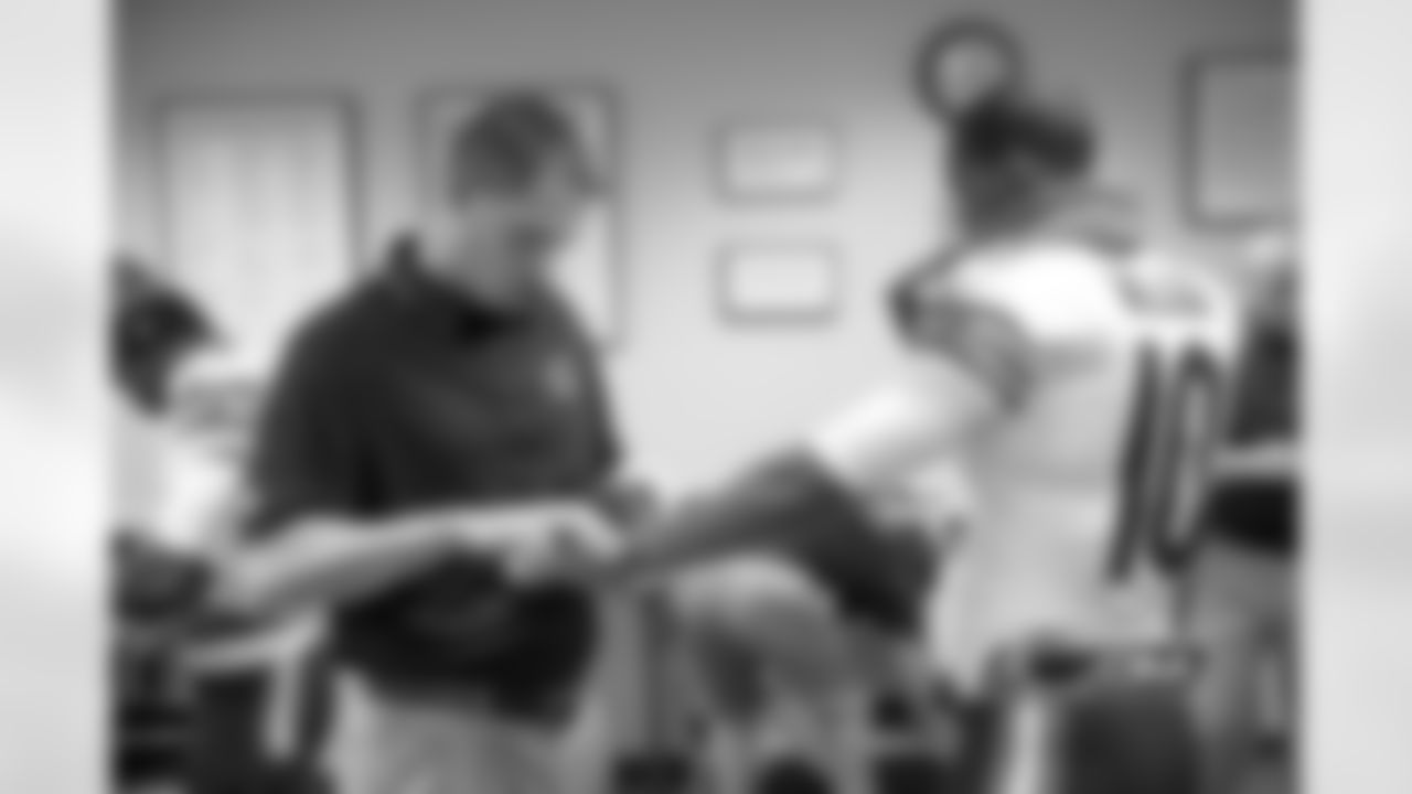 Rookie receiver Marquees Wilson gets treatment on his wrist from one the Bears athletic trainers.
