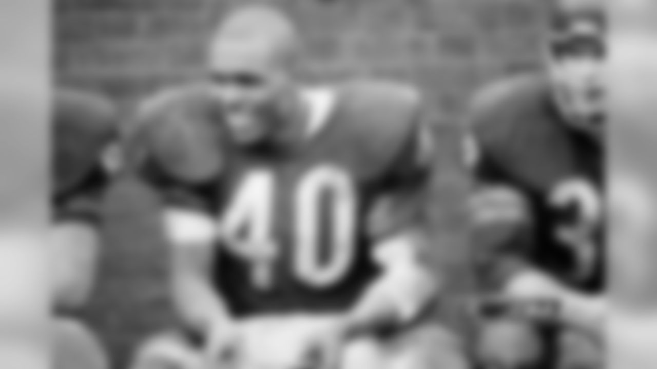 Gale Sayers, Chicago Bears' sensational halfback, smiles happily after scoring six touchdowns against San Francisco 49ers. The Bears won, 61-20, in Chicago, Dec. 12, 1965. The remarkable Kansas rookie boosted his season touchdown total to 21, a new NFL record at the time.