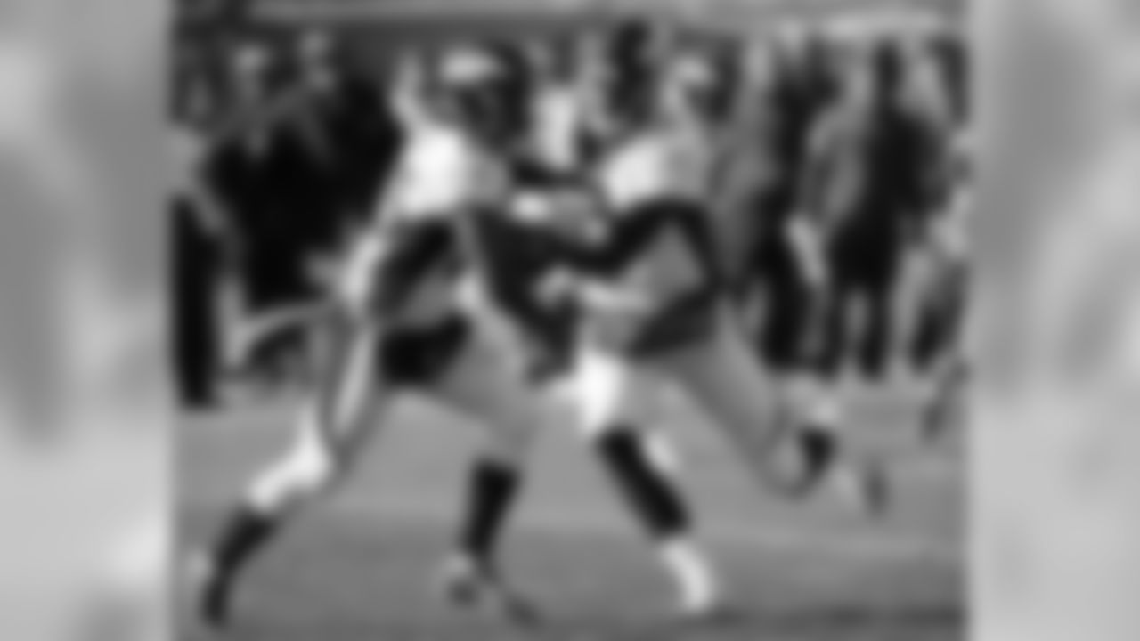 Denver Broncos quarterback Brock Osweiler hands off the ball to running back Ronnie Hillman