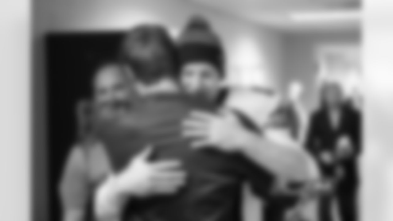 Quarterbacks Jay Cutler and Josh McCown embrace after a hard fought win against the Packers.