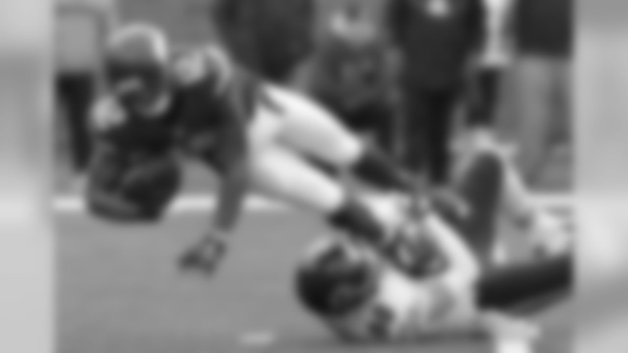 Vikings WR Charles Johnson is tackled by Bears LB Shea McClellin