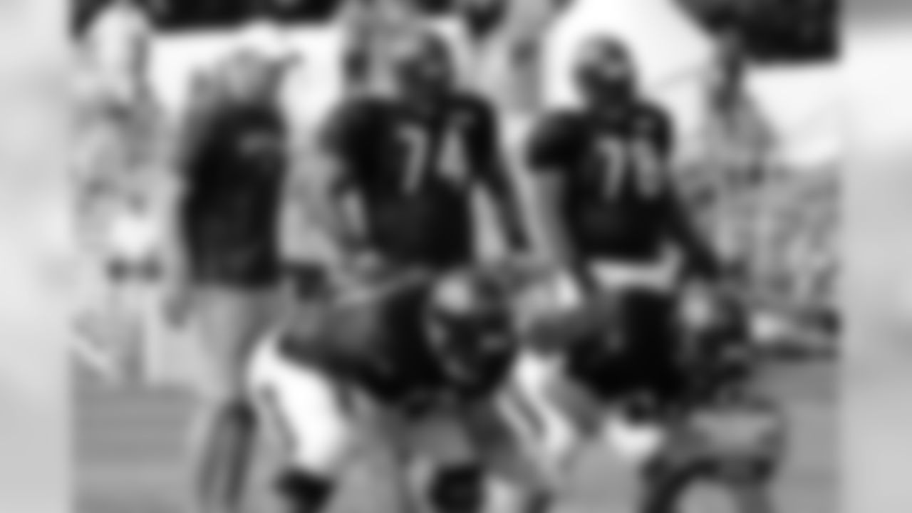 Offensive Coordinator Aaron Kromer works with the line - LT Jermon Bushrod, G/T James Brown, C Roberto Garza, G Matt Slauson