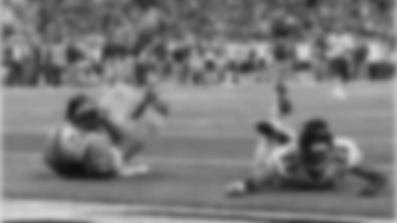 Detroit Lions wide receiver Calvin Johnson, defended by Chicago Bears cornerback Kyle Fuller falls into the end zone for a touchdown.