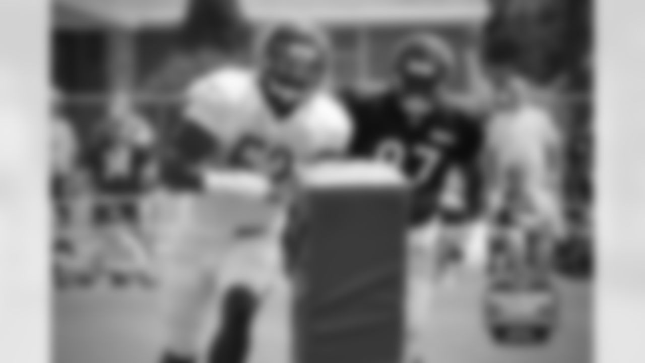 LB Christian Jones (52) and TE Greg Scruggs (87).