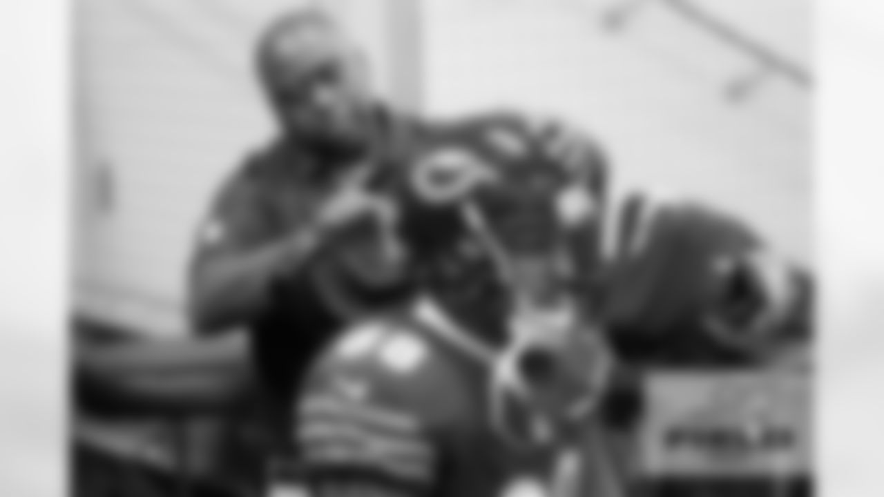TE Dante Rosario, Head Equipment Manager Tony Medlin