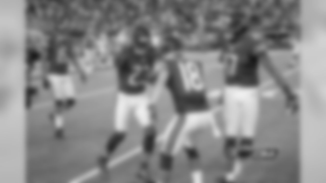 Fellow wideouts Dane Sanzenbacher and Alshon Jeffery congratulate Bears WR Devin Hester after his 34-yard touchdown reception.