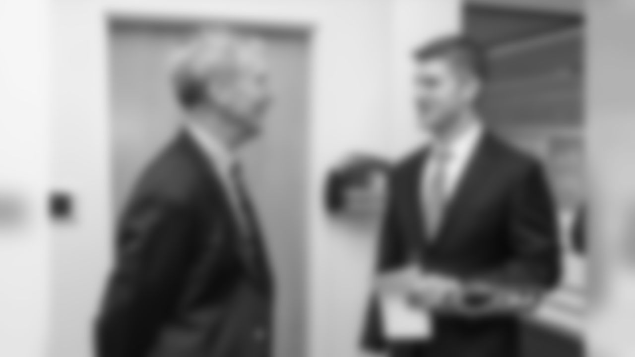 Bears Chairman George McCaskey speaks with GM Ryan Pace.