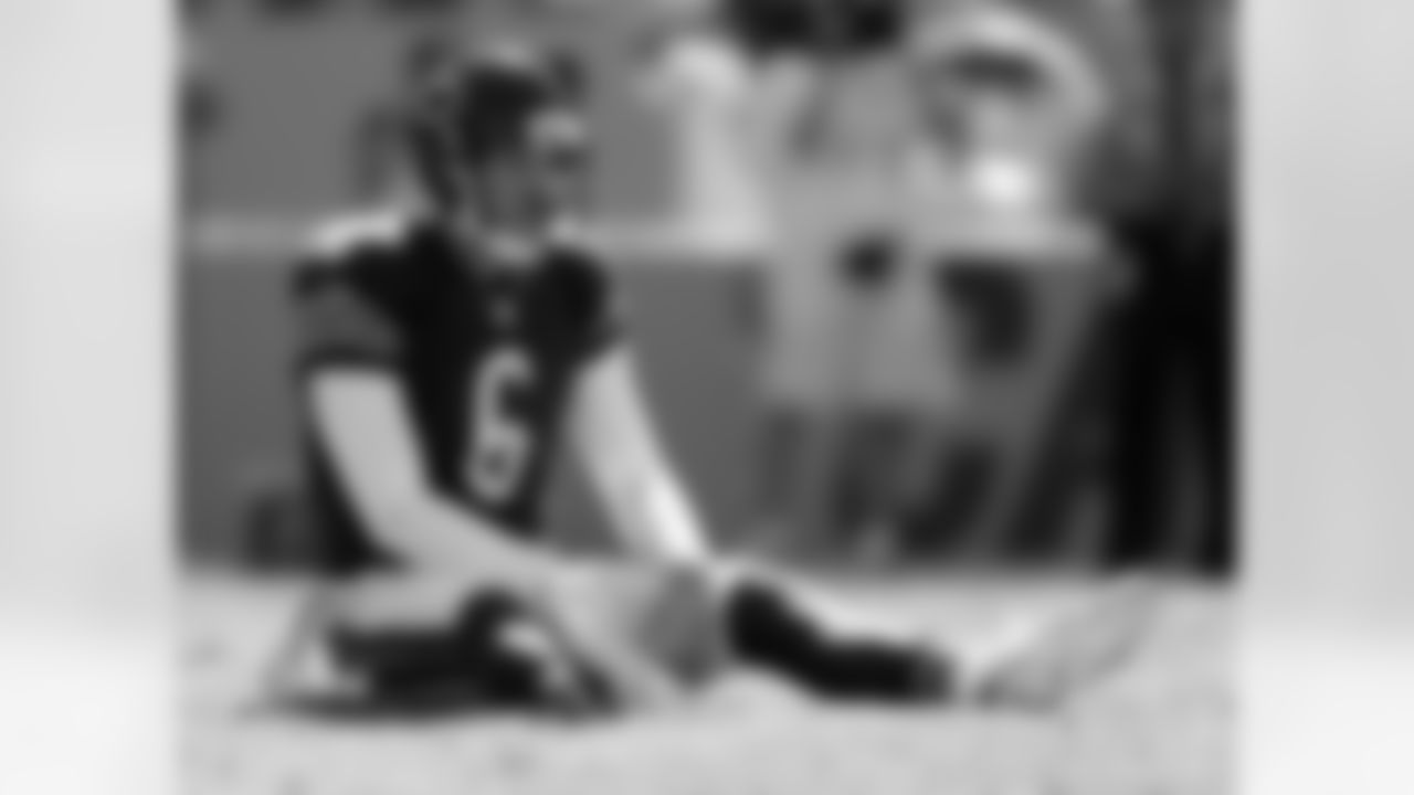Chicago Bears' Jay Cutler (6) sits on the ground after being hit after a pass against the Carolina Panthers during the second half of an NFL football game in Charlotte, N.C., Sunday, Oct. 5, 2014. (AP Photo/Bob Leverone)