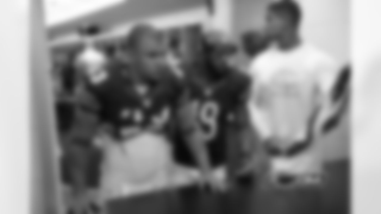 Fullback Tony Fiammetta (L), receiver Joe Anderson (C), and defensive end Corey Wootton (R)