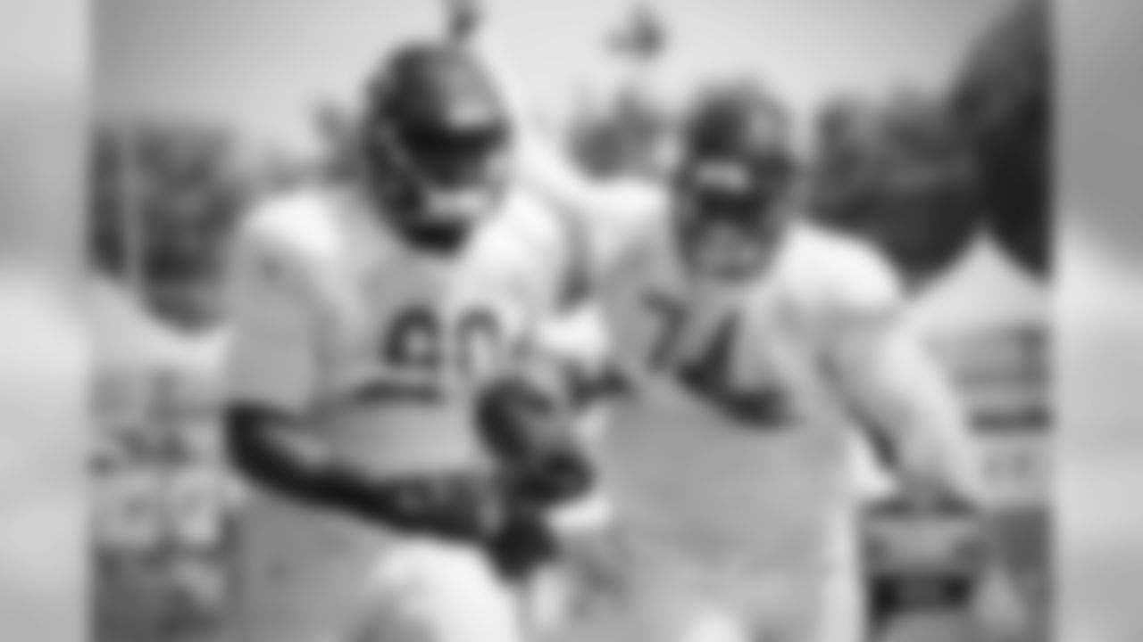 DL Cornelius Washington (90) and DL Jonathan Bullard (74).