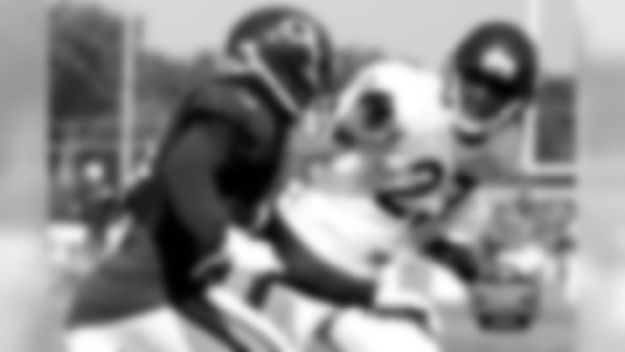 WR Eric Weems looks for seperation from CB Sherrick McManis on a play.
