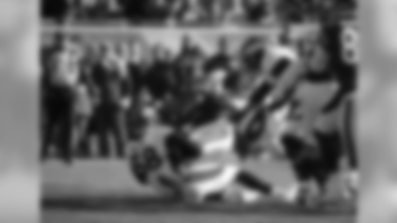 Chicago Bears running back Jeremy Langford is tackled by Denver Broncos outside linebacker Von Miller
