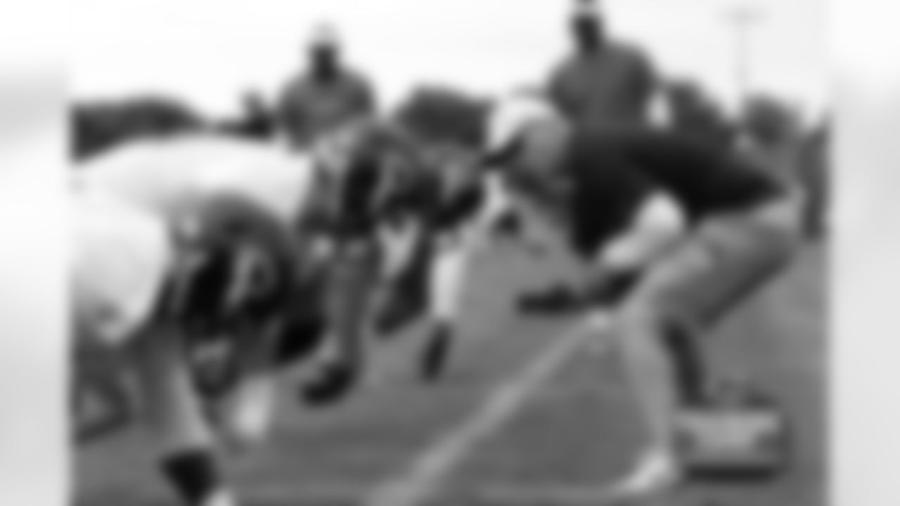 Defensive Line Coach Mike Phair works with the line