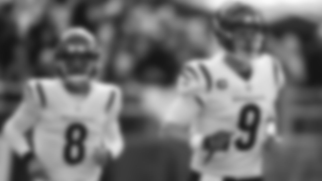 Cincinnati Bengals quarterback Brandon Allen (8) and quarterback Joe Burrow (9) take the field to work out prior to an NFL football game against the Baltimore Ravens, Sunday, Oct. 24, 2021, in Baltimore. (AP Photo/Gail Burton)