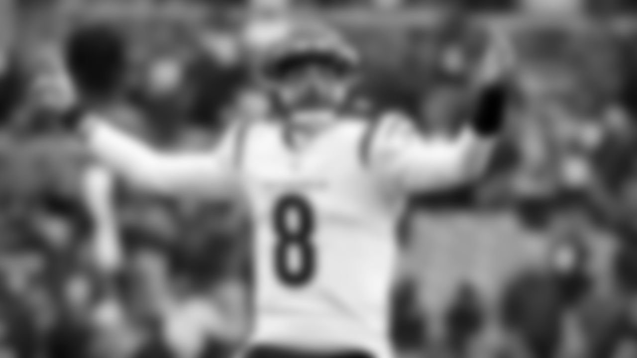 Cincinnati Bengals quarterback Brandon Allen (8) calls for a two-point conversion after scoring a touchdown during an NFL football game against the Cleveland Browns, Sunday, Jan. 9, 2022, in Cleveland. (AP Photo/Kirk Irwin)