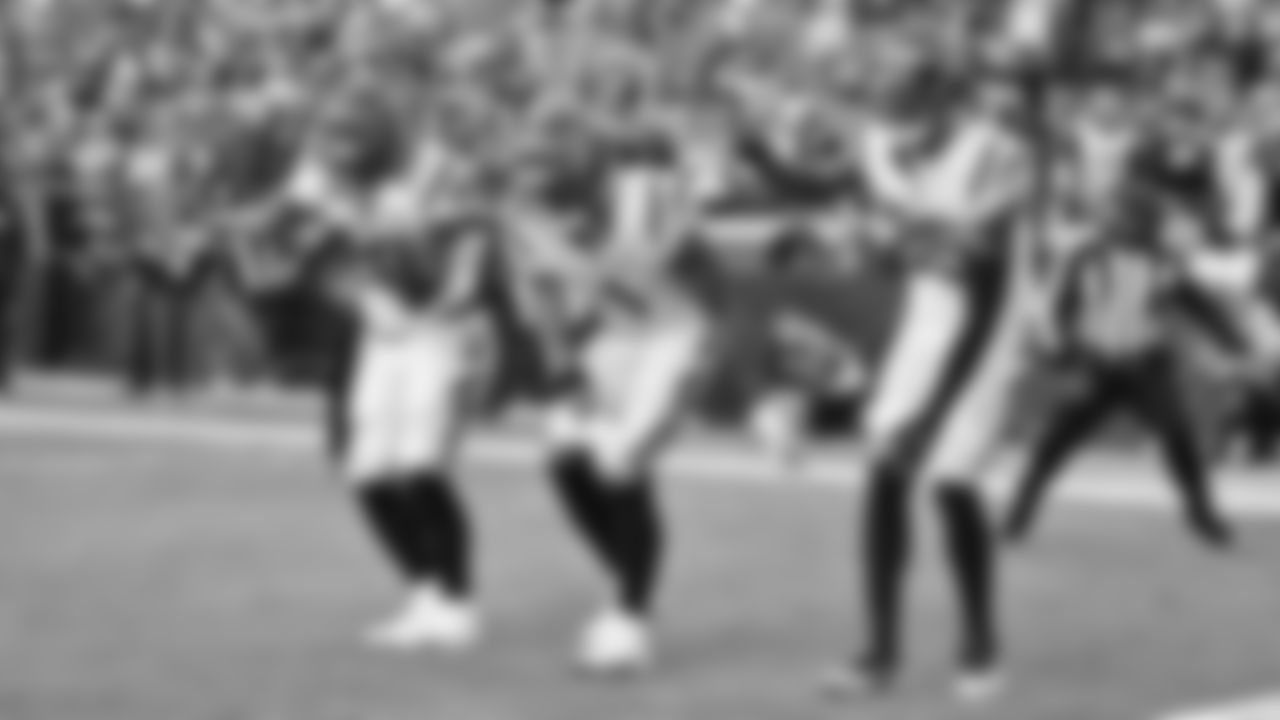 Joe Mixon (left), Ja'Marr Chase (center) and Tee Higgins (right) celebrate in the end zone after a touchdown against the Kansas City Chiefs.