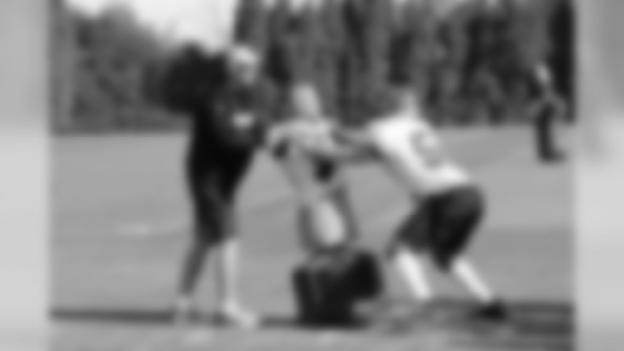 Jim Haslett working with Hardy Nickerson at Wednesday's practice.