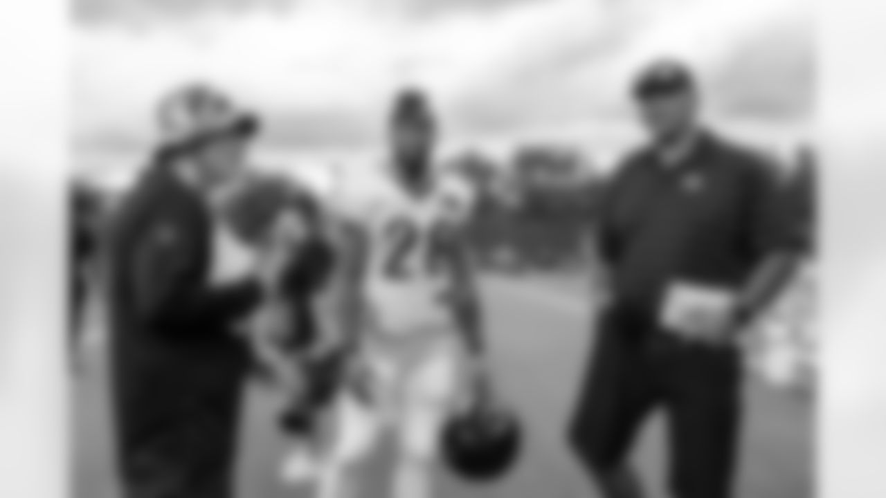 (Left to right) Bengals Senior Writer Geoff Hobson, HB Joe Mixon and Bengals Legend Anthony Munoz talk during Training Camp at Kettering Health Practice Fields on Monday, August 7, 2023 in Cincinnati, Ohio.