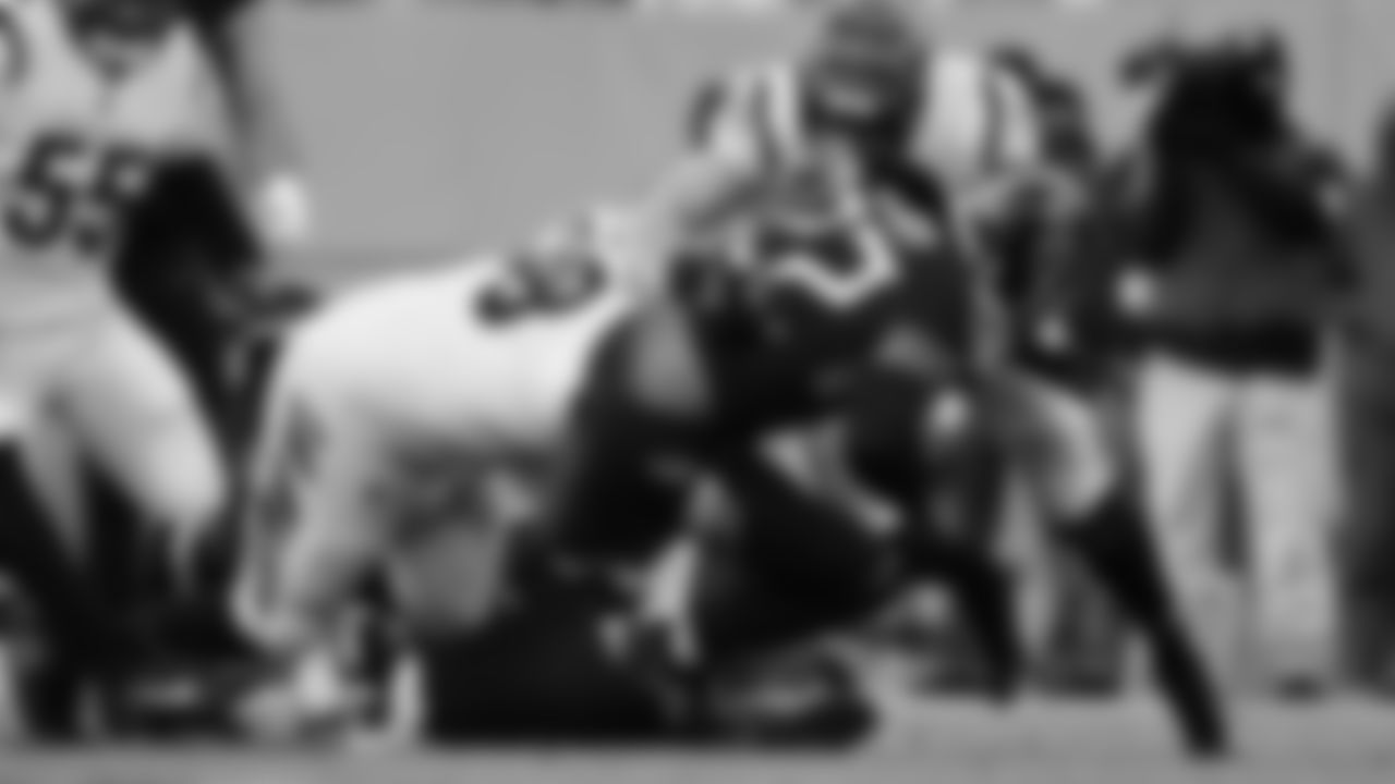 D.J. Reader and Sam Hubbard tackle Titans running back Derrick Henry behind the line of scrimmage in the AFC Divisional Round.