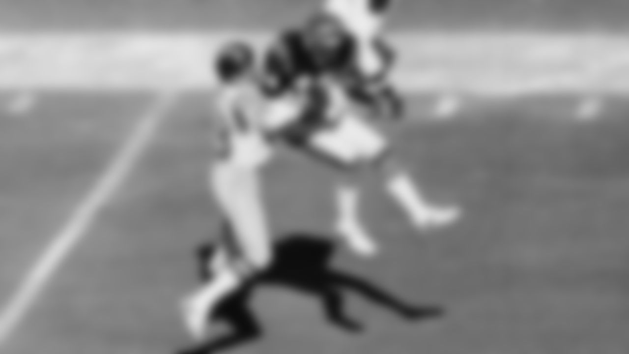 Cincinnati Bengals cornerback Louis Breeden, right, intercepts a pass to San Diego Chargers receiver Charlie Joyner, left, to break up a second quarter drive by the Chargers in Cincinnati on Jan. 10, 1982. Breeden's interception came on the Bengals six yard line. (AP Photo)
