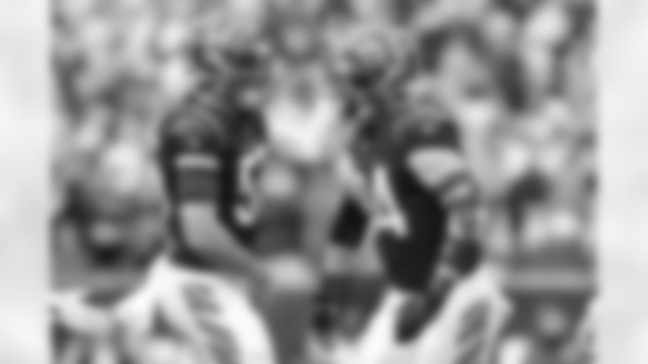 LB Logan Wilson (left) and DE Sam Hubbard celebrate during the first quarter of the Browns-Bengals game in Week 14 at Paycor Stadium in Cincinnati, Ohio.