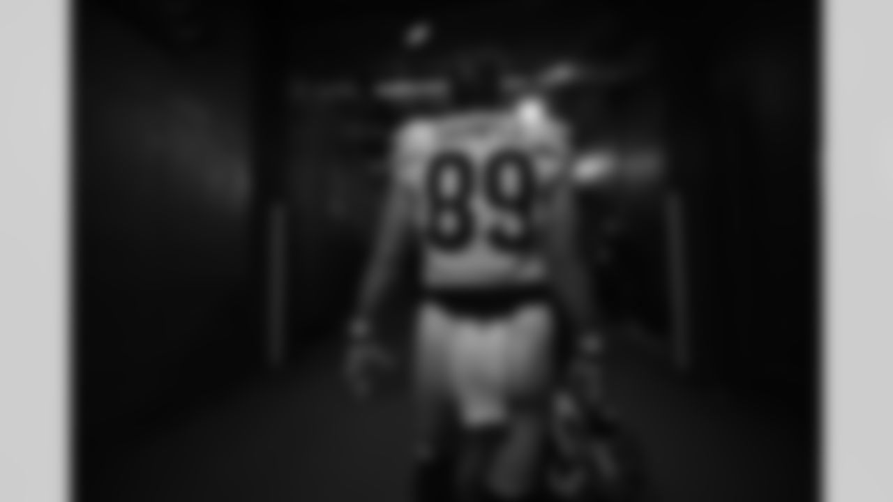 TE Drew Sample walks out to the field before kickoff of the 2021 AFC Championship at Arrowhead Stadium.