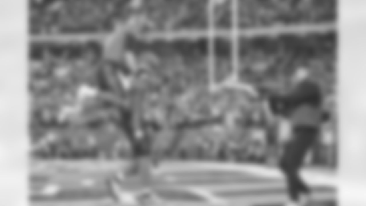 QB Joe Burrow (left) celebrates with WR Tee Higgins after Higgins scored a touchdown during the second quarter of the Chiefs-Bengals game in Week 13 of the 2022 season at Paycor Stadium in Cincinnati, Ohio.